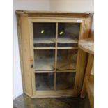 A Pine cricket table of typical form together with a pine corner cupboard,