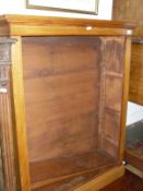 An oak open bookcase in the Victorian manner