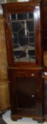 A circa 1900 mahogany corner cabinet of small proportions,
