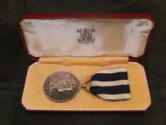 An Elizabeth II silver police medal for Distinguished Police Service awarded to Frederick A Statham
