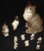 A Beswick Pottery seven-piece miniature cat band and three various Beswick cats