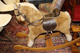 A Mamas and Papas rocking horse,