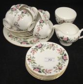 A Wedgwood "Hathaway Rose" six plate part tea service, together with two glass candlesticks,