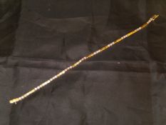 An 18 carat gold box link bracelet set with thirty small diamonds,