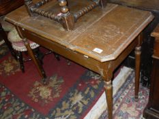 A late Victorian oak writing table,