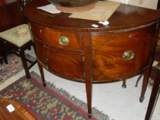 An Edwardian mahogany sideboard of demi-lune form,