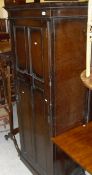 An oak single door wardrobe to plinth base,