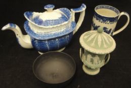 A 19th Century blue and white mug "Indian Tree" decoration, a Wedgwood black basalt bowl,