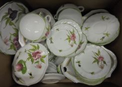 A Continental part dinner and tea service decorated on a white ground with pink roses and green