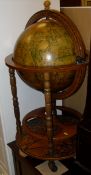 A Stag Minstrel mahogany open bookcase with single drawer, a reproduction Globe drinks cabinet,