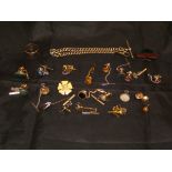 A collection of various tie pins,