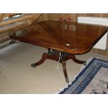 A late Regency mahogany tilt-top breakfast table of rectangular form with rounded corners,