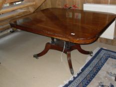 A late Regency mahogany tilt-top breakfast table of rectangular form with rounded corners,