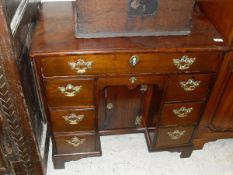 An 18th Century fruitwood kneehole desk,