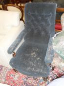A circa 1900 mahogany framed button back salon chair with blue upholstery,