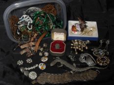 Two tubs of various costume jewellery