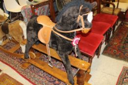 Mamas and papas rocking horse with Mamas and Papas Pony club rosette "A Horse with No Name"