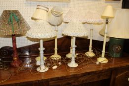 Assorted turned wooden and cream painted table lamp bases and various other table lamps