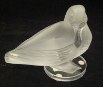 A Lalique frosted glass figure of a duck standing upon a circular base,