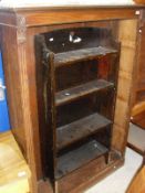 An oak open bookcase with four shelves and a white painted bookcase,