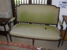 A Louis XVI style two seater sofa with green upholstery