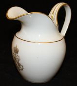 A 19th Century Sevres porcelain milk jug with simple gilt line decoration and crowned "N" monogram