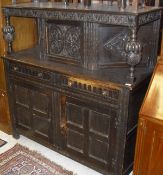 A reproduction oak court cupboard, an oak drop-leaf table on four turned supports,