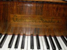 An early 20th Century rosewood cased baby grand piano in the Art Nouveau style,