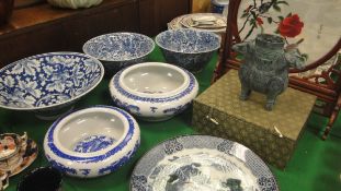 A pair of 20th Century Chinese blue and white decorative bowls each bearing six character marked to