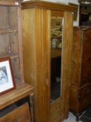 A late Victorian ash single mirror door wardrobe and five various prints