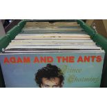 Four boxes of miscellaneous items to include one box of records including Adam and the Ants "Prince