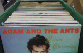 Four boxes of miscellaneous items to include one box of records including Adam and the Ants "Prince