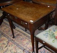 A 19th Century oak single drawer side table on turned tapering legs to pad feet