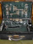 A late Victorian green dyed leather lady's vanity case containing various fittings including