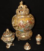 A Japanese Meiji period satsuma ware koro on tripod base, a smaller bell shaped vase and cover,