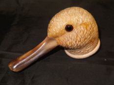 A carved Meerschaum pipe as a duck's head with glass eyes and horn mouthpiece or bill