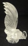 A Lalique glass figure of a cockerel, his head close to the ground,