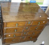 A 19th Century and later Oak chest of four long graduated drawers with brass handles,