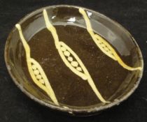 A brown ground Winchcombe dish decorated with barley flashes circa 1935 CONDITION REPORTS
