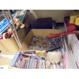 Seven boxes of assorted items to include DVDs, child's games, car battery chargers,