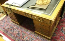 An oak desk in the Victorian manner,