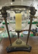 A Louis XV style brass candle holder with clear glass bowl,