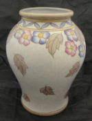 A Charlotte Rhead Bursley Ware vase of baluster form decorated with autumnal flowers on a mottled