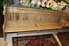 A 19th Century pine pew CONDITION REPORTS The bench has signs of being left outside.