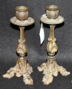 A pair of 19th Century gilt bronze candlesticks in the Rococo taste with facet shaped column set