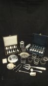 A collection of small silver wares to include two sets of six silver teaspoons,