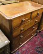 A Victorian mahogany bow fronted chest of two short over three long drawers flanked by turned side