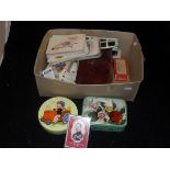 A box containing various playing cards, Brooke Bond tea cards,