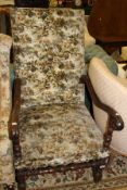 A 19th Century walnut armchair in a cream ground foliate patterned upholtered back and seat,