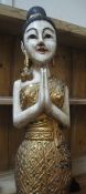 A modern carved and painted wooden figure of an Oriental maiden,